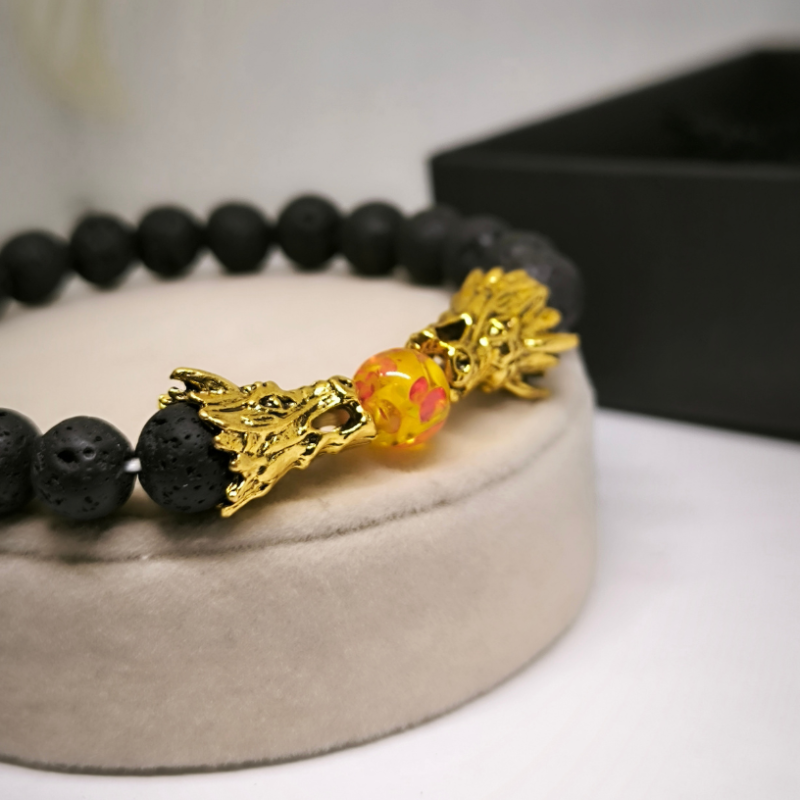 Laavakivist helmekäevõru draakonitega