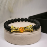 Laavakivist helmekäevõru draakonitega