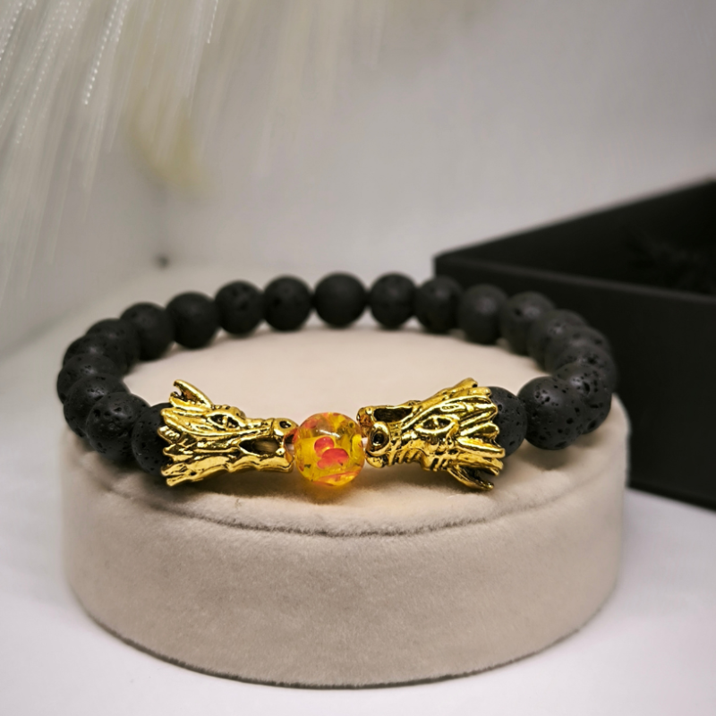 Laavakivist helmekäevõru draakonitega