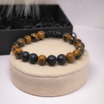 Moodne käevõru laavakivist ja tiigrisilma helmestega