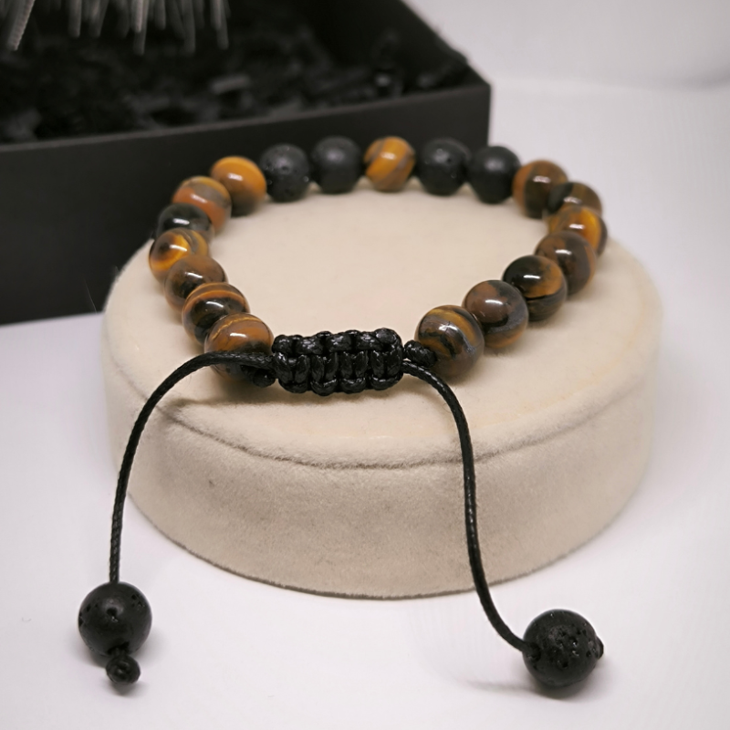 Moodne käevõru laavakivist ja tiigrisilma helmestega