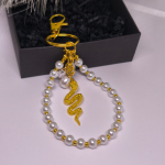 Käsitööna valminud käekotid ja võtmehoidja „Pärlikäärme“