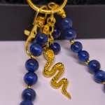 Käsitööna valminud käekotid ja võtmehoidja „Öö madu“